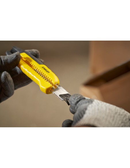 Cúter bi-material segmentación lateral con deslizador estándar 18 mm